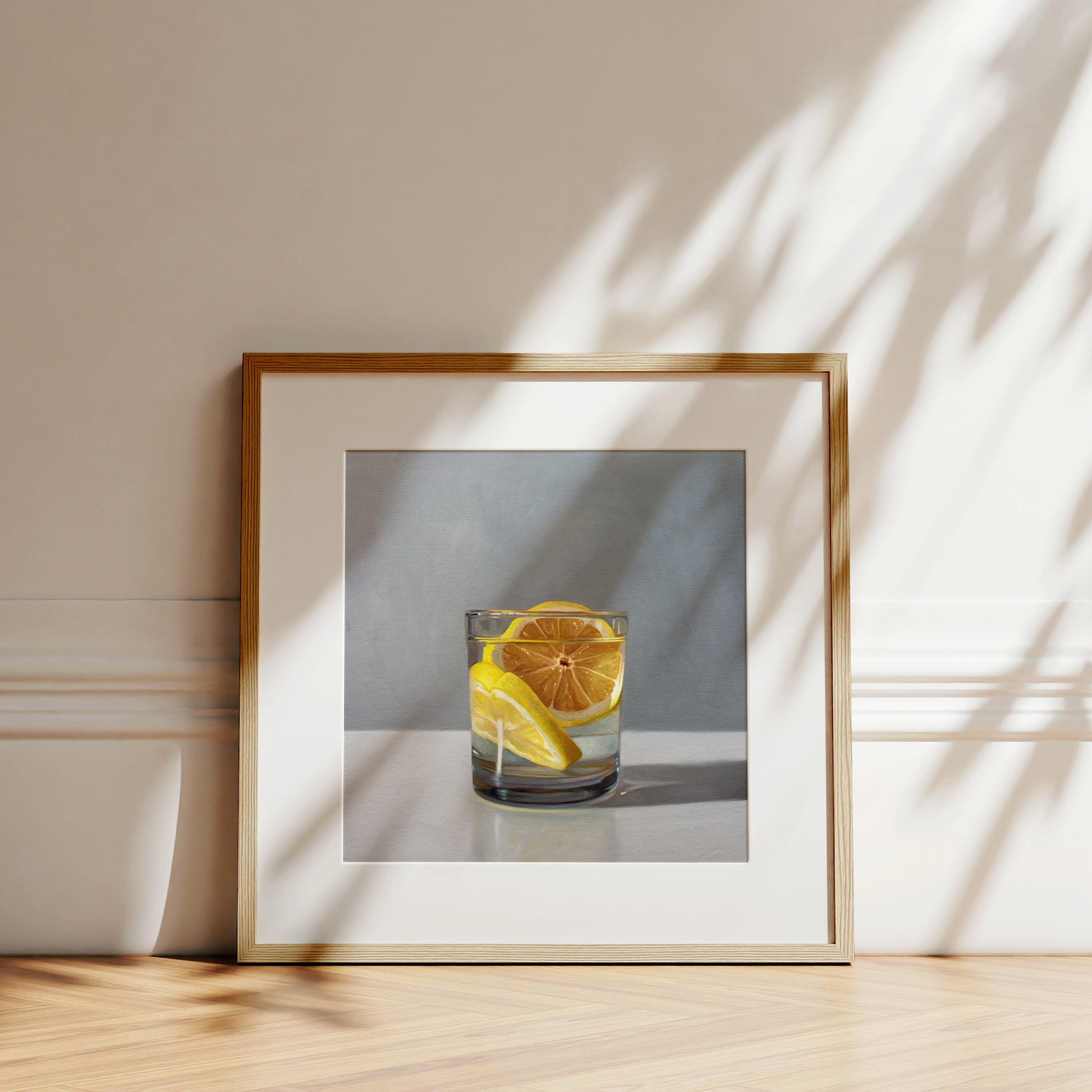 This artwork features a short glass of gin and tonic with two slices of lemon.