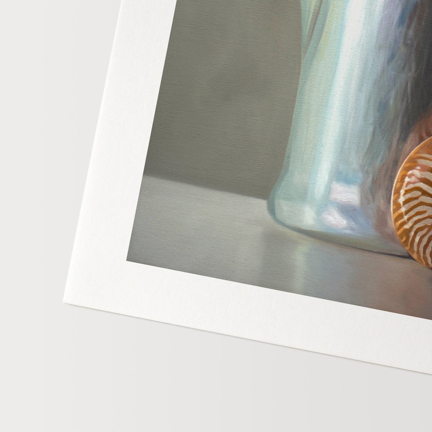This artwork features a nautilus shell resting next to a vintage tea kettle.This artwork is from a series featuring tea kettles paired with various objects.