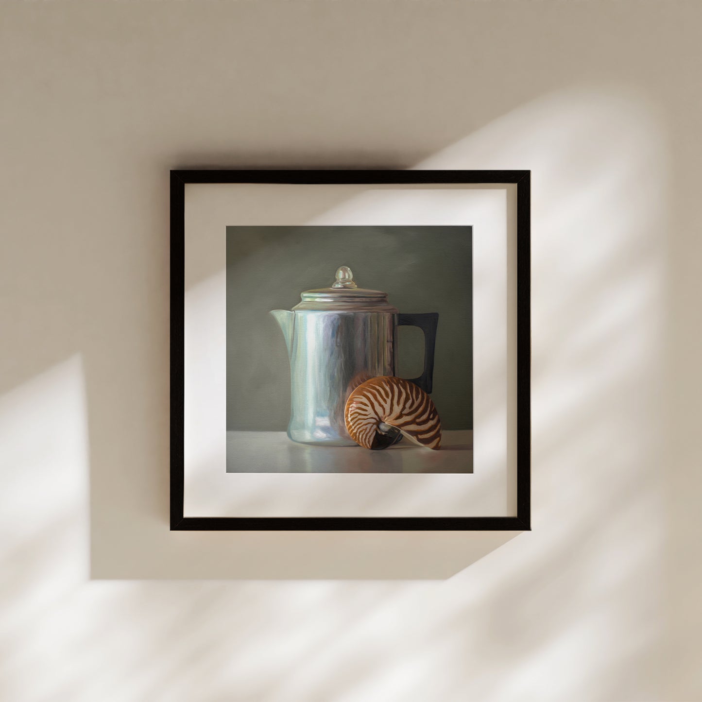 This artwork features a nautilus shell resting next to a vintage tea kettle.This artwork is from a series featuring tea kettles paired with various objects.