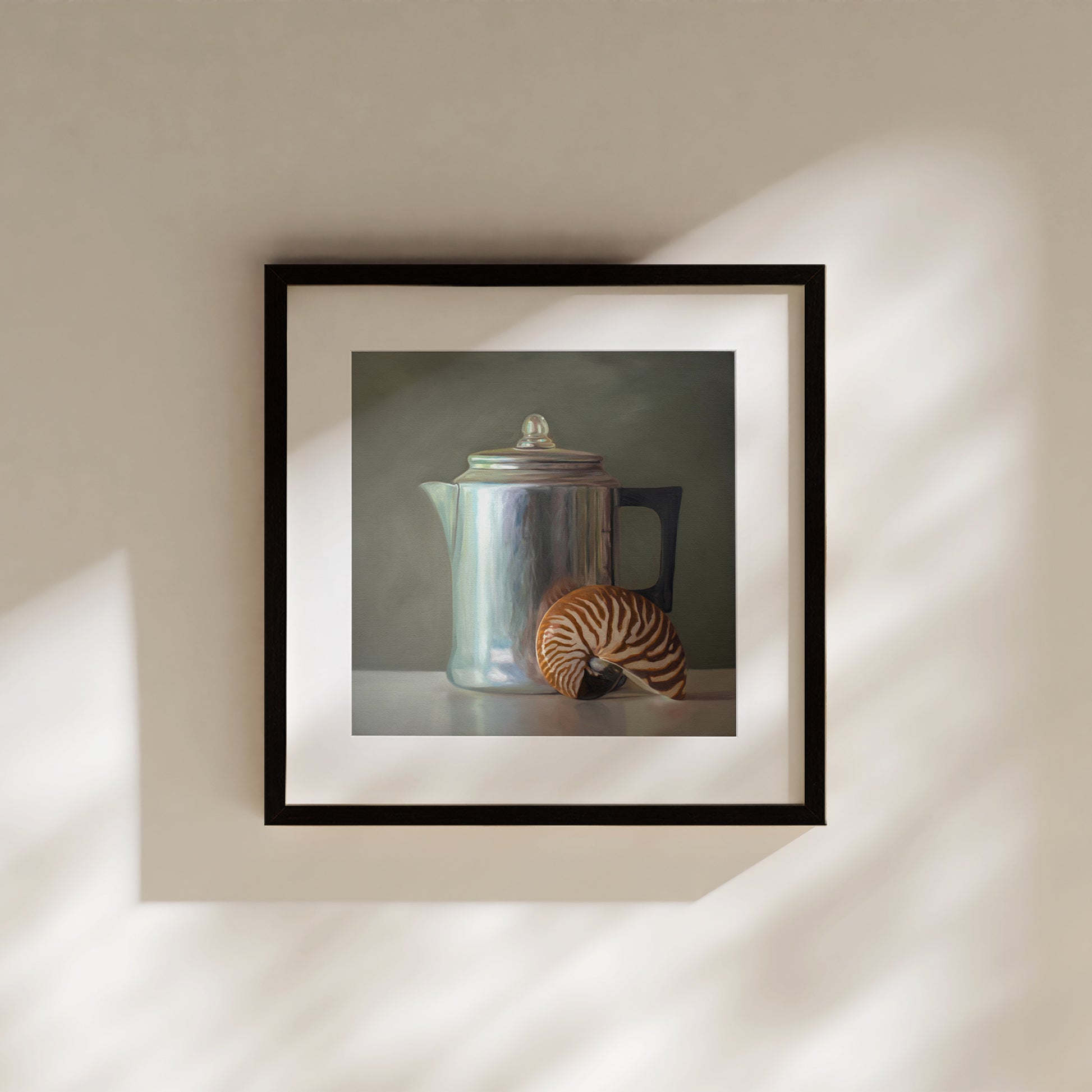 This artwork features a nautilus shell resting next to a vintage tea kettle.This artwork is from a series featuring tea kettles paired with various objects.