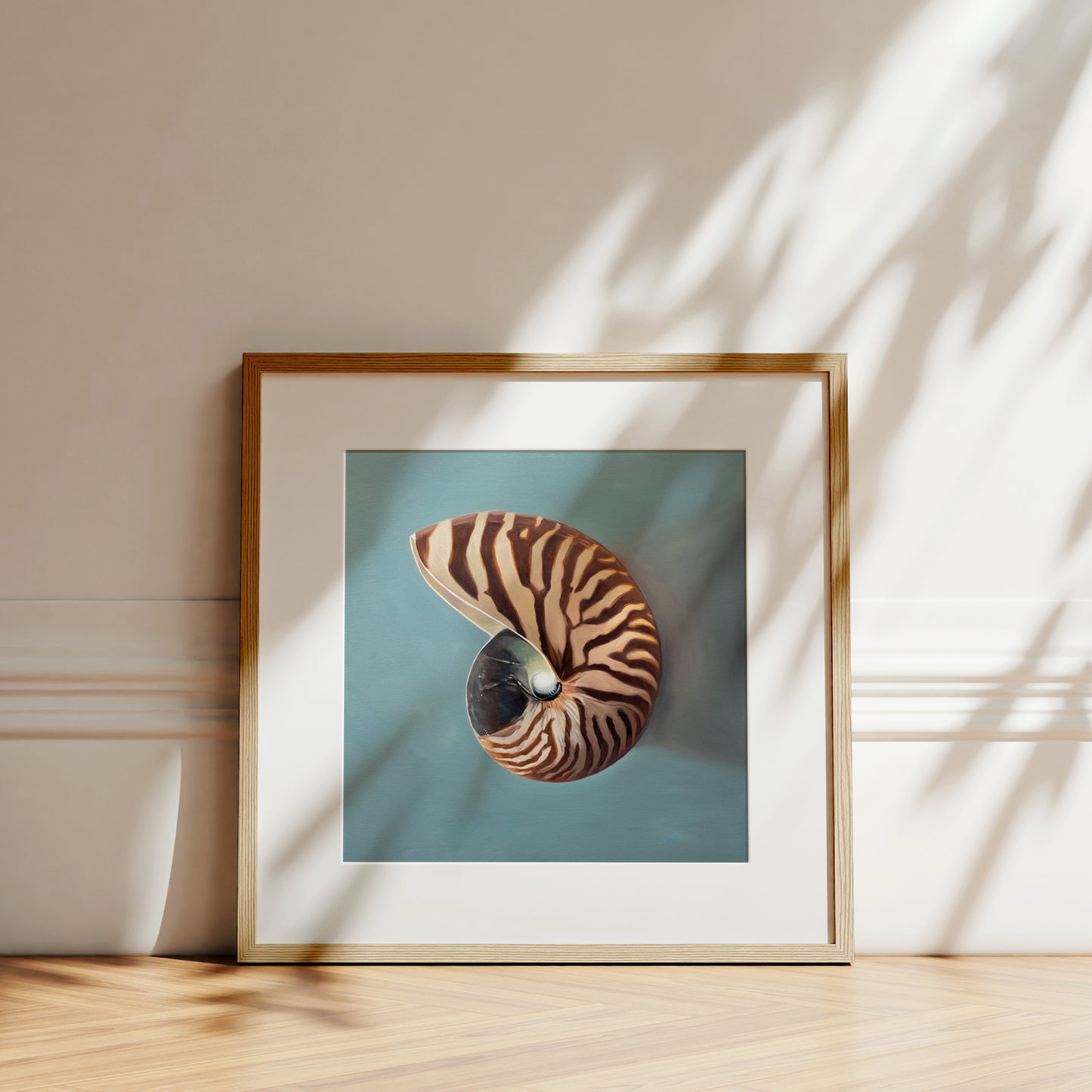 This artwork features a beautifully striped nautilus shell resting on a light blue surface.