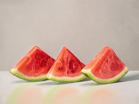 This artwork features a freshly sliced trio of watermelon wedges lined up on a reflective surface with some nice dramatic lighting.