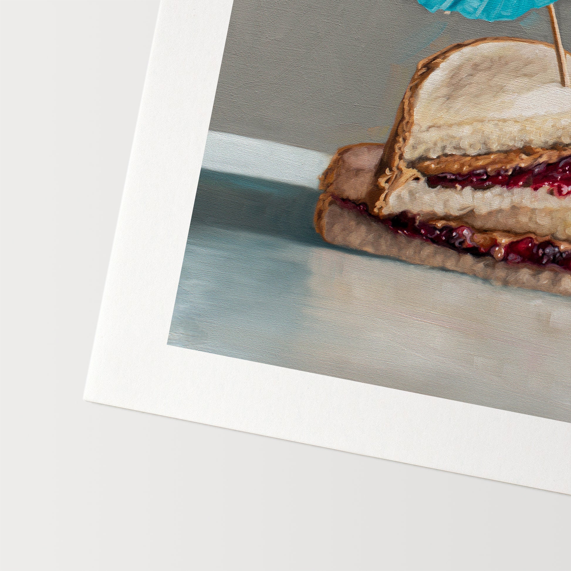 This artwork features a classic peanut butter and jelly sandwich basking under the shade of a cocktail umbrella.