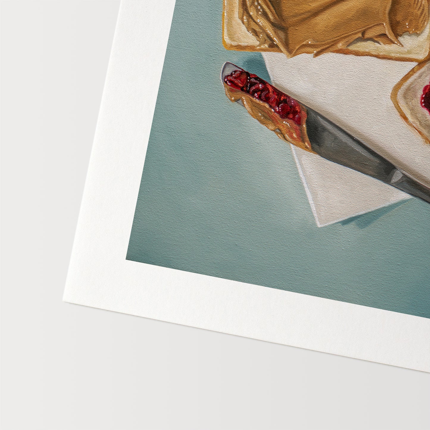 This artwork features a yet to be assembled peanut butter and jelly sandwich… the very moment just before you smoosh the two sides together.