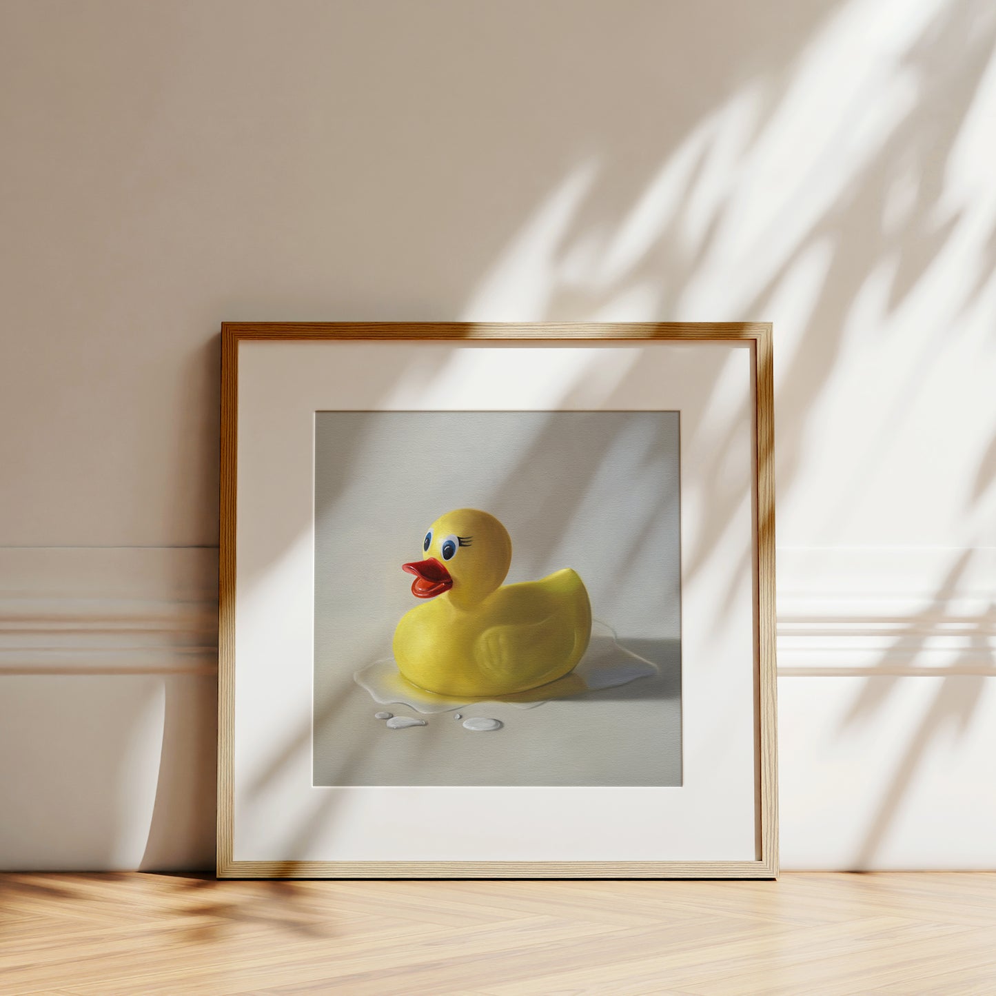 This artwork features a rubber ducky resting on a light surface surrounded by water droplets with some nice dramatic lighting.