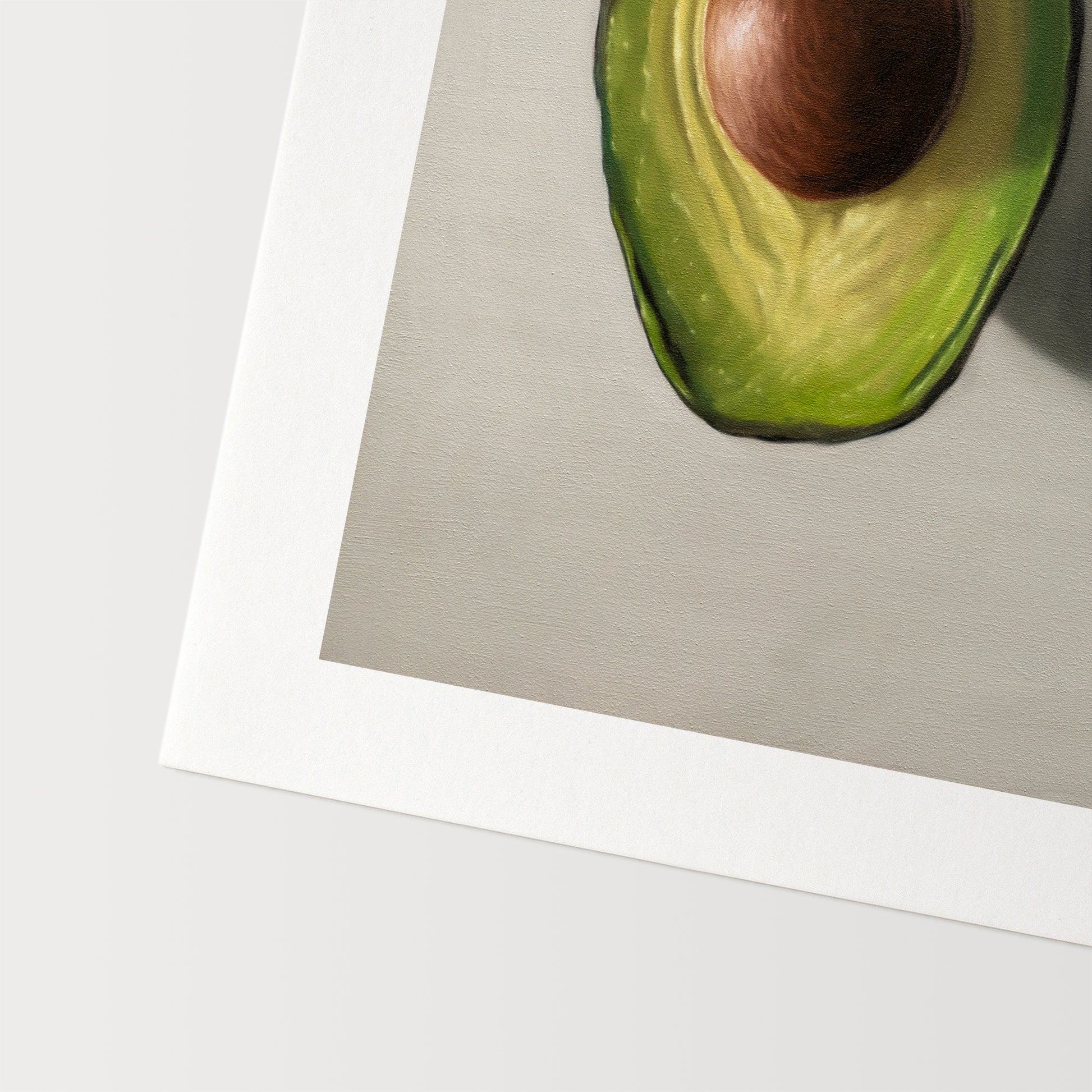 This artwork features a single avocado sliced in half and viewed from above on a light surface.