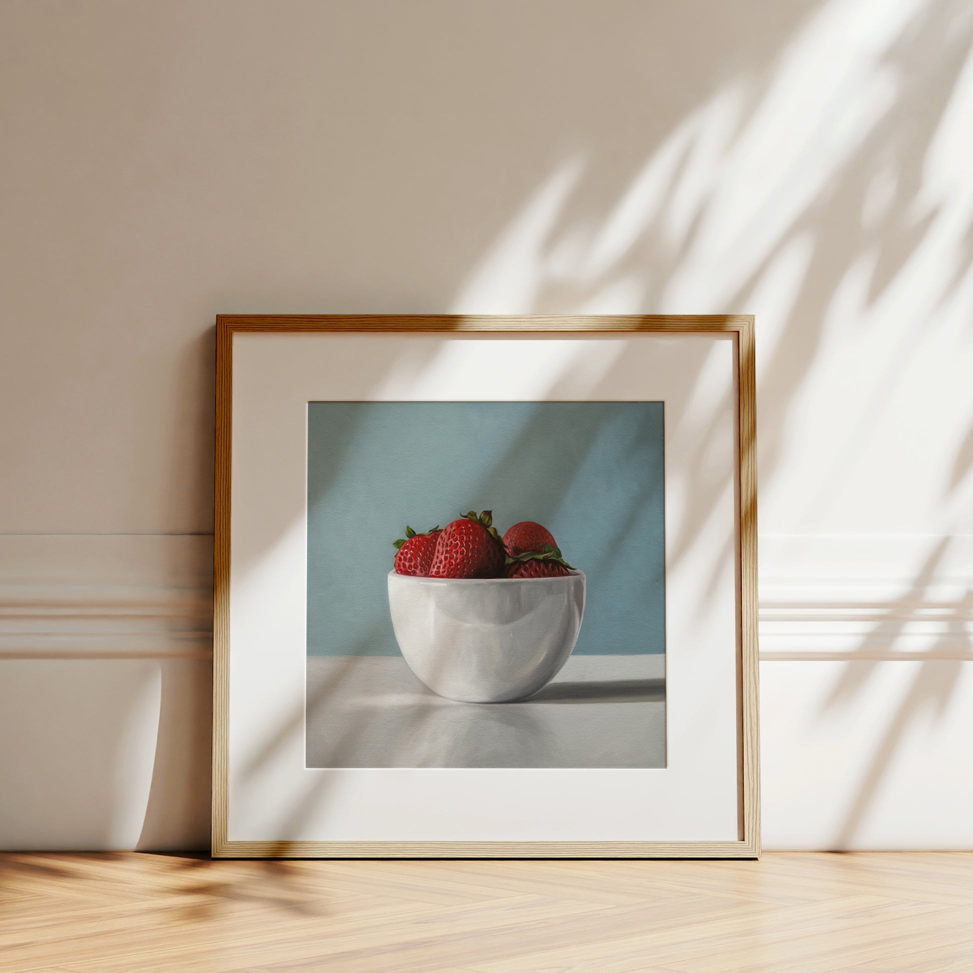 This artwork features a white porcelain cup filled with plump strawberries.
