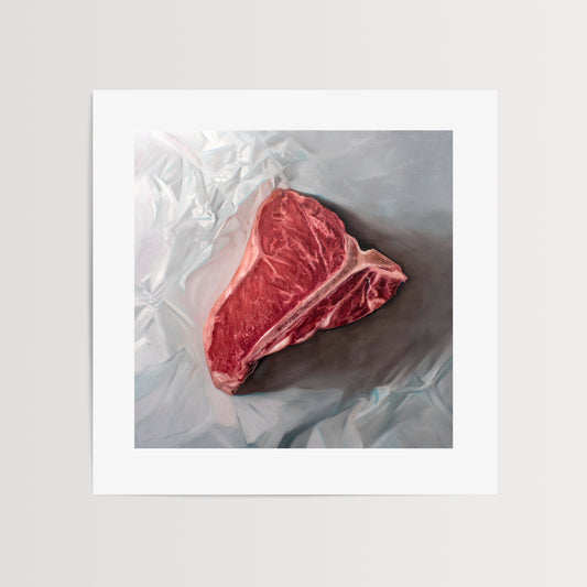 This artwork features a fresh t-bone resting upon a crinkled white wax paper sheet.