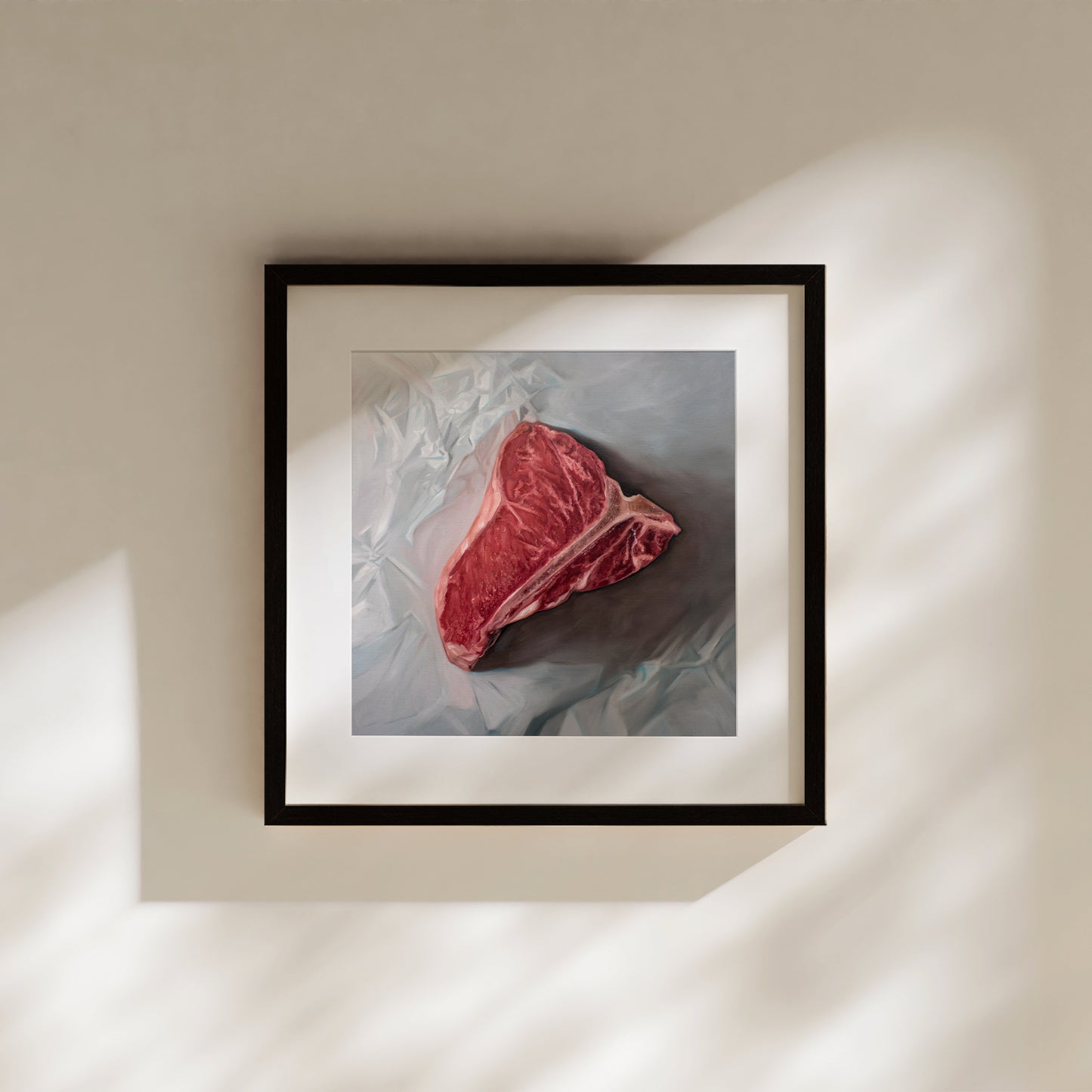 This artwork features a fresh t-bone resting upon a crinkled white wax paper sheet.