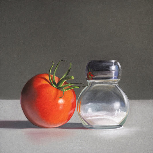 This artwork features a single fresh garden tomato situated by a reflective salt shaker.