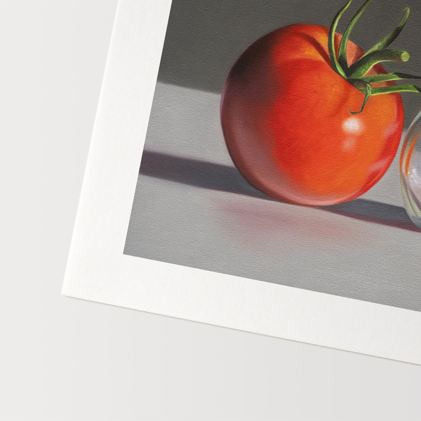 This artwork features a single fresh garden tomato situated by a reflective salt shaker.
