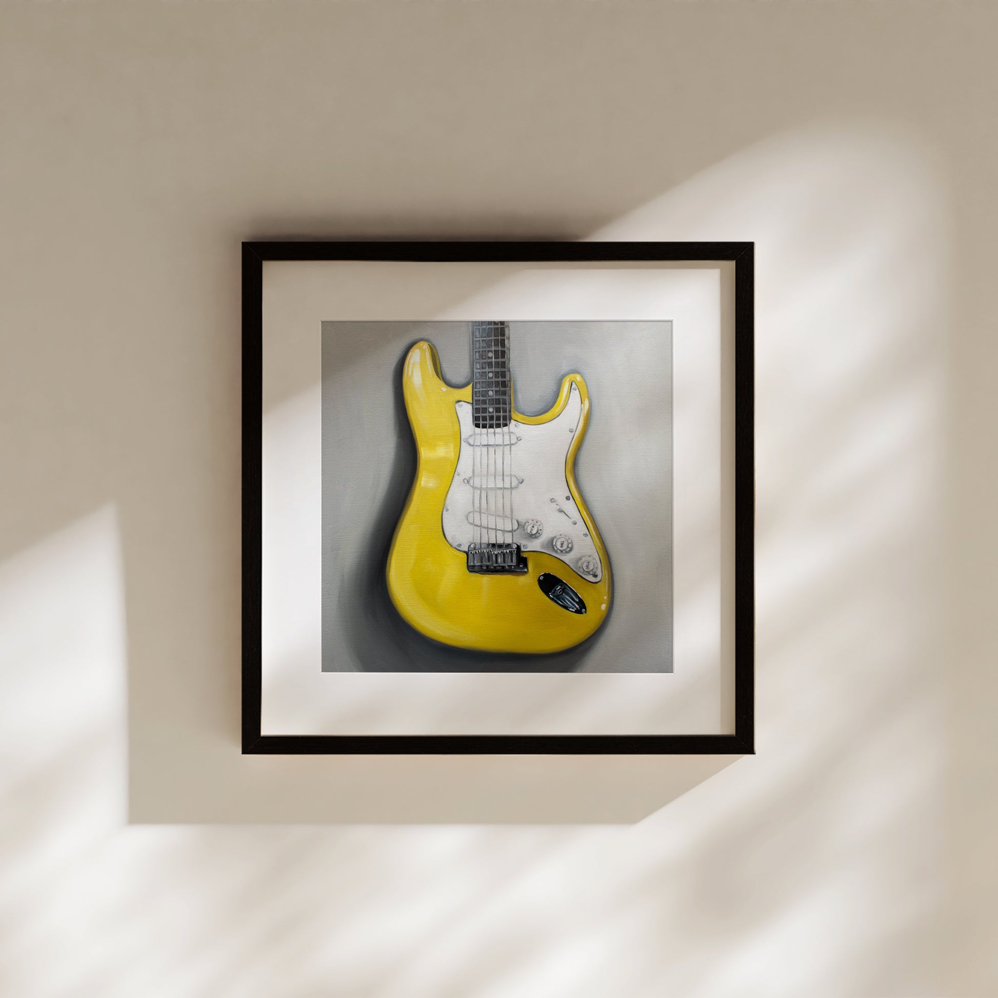 This artwork features a close up view of a bright yellow Stratocaster Guitar resting on a light grey surface.