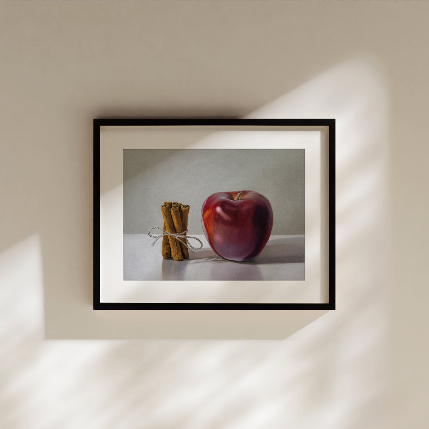 Apple Cinnamon Fine Art Print by Lauren Pretorius: a bundle of cinnamon sticks standing next to a red delicious apple with a neutral, minimalistic backdrop.