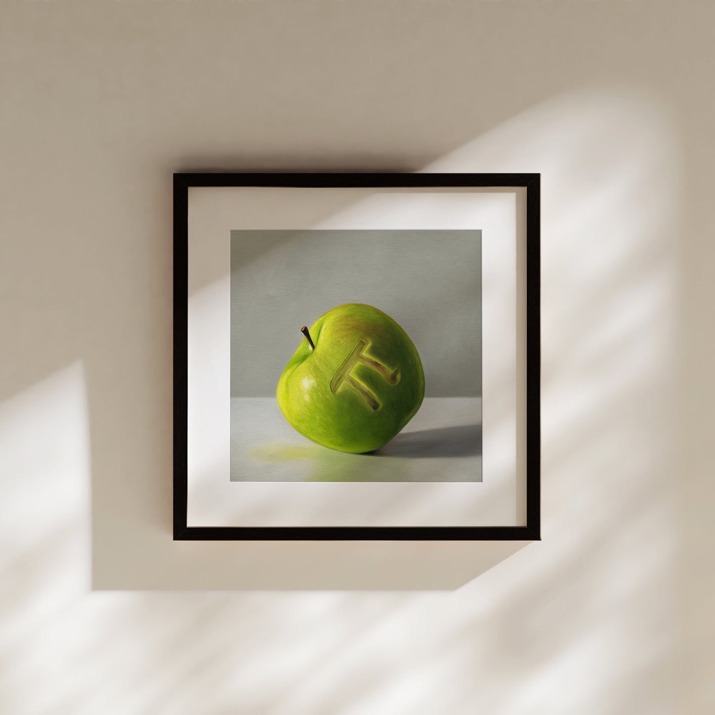 Framed fine art print of a green apple with a carved "Pi" symbol, on a light background.