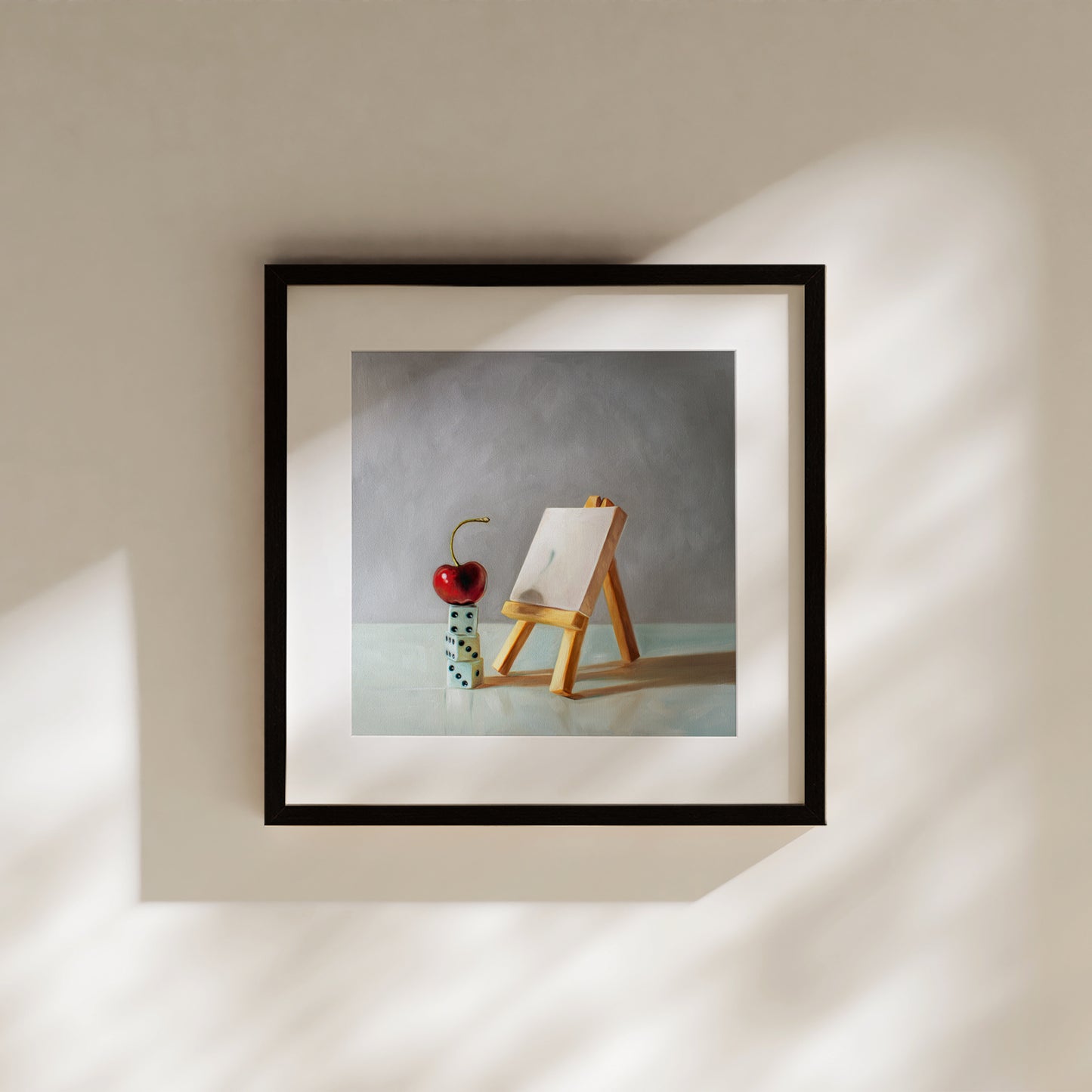 Artist's Block Fine Art Print by Lauren Pretorius: a bright red cherry in front of a mini blank canvas on a mini easel seemingly having a case of ‘Artist’s Block’.It goes without saying that all artists can almost certainly relate to the little guy!