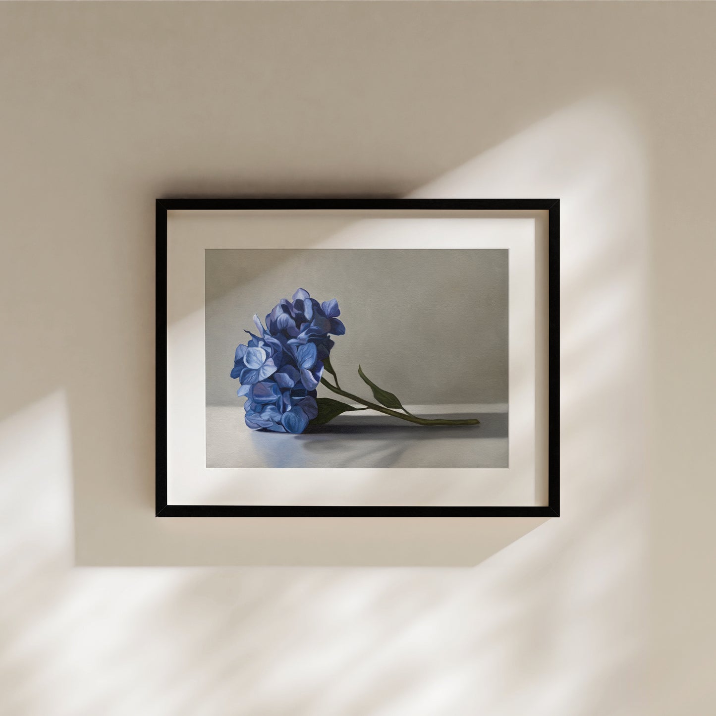 Blue Hydrangeas Fine Art Print by Lauren Pretorius: a bouquet of blue hydrangeas resting on a light surface with a neutral background.