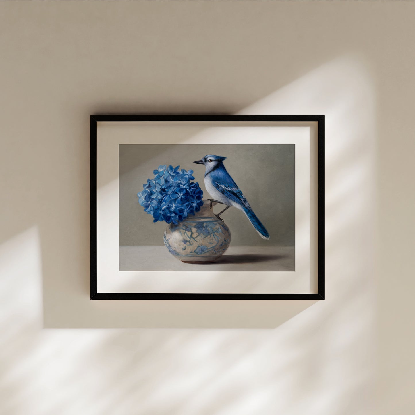 Blue Jay & Hydrangeas Fine Art Print by Lauren Pretorius: a Blue jay perched on a vase with blue hydrangea flowers against a neutral background