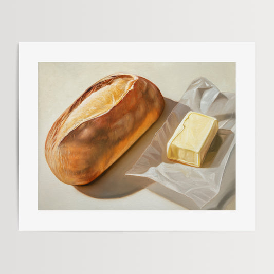 Bread & Butter Fine Art Print by Lauren Pretorius: a loaf of bread and a block of butter on a white surface.