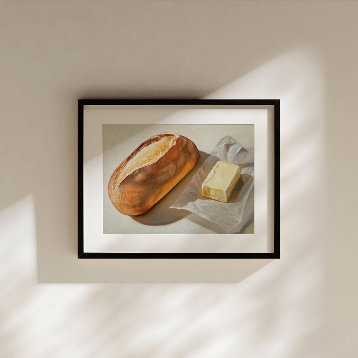 Bread & Butter Fine Art Print by Lauren Pretorius: a loaf of bread and a block of butter on a white surface.