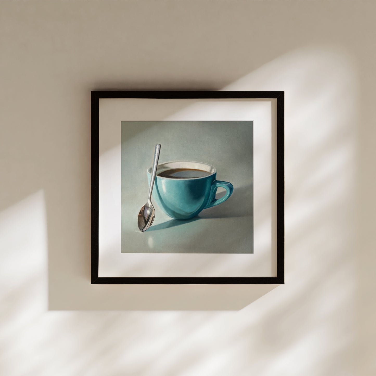 Coffee Cup & Spoon Fine Art Print by Lauren Pretorius: a blue cup of coffee with a spoon resting on the cup.