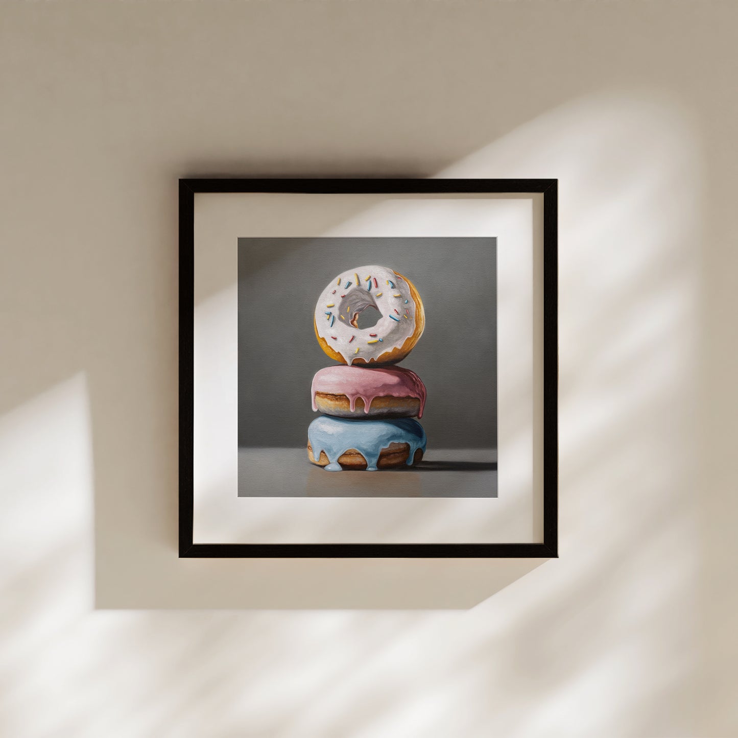Donut Stack Trio Fine Art Print by Lauren Pretorius: a trio of donuts with different colored frosting stacked top of each other.