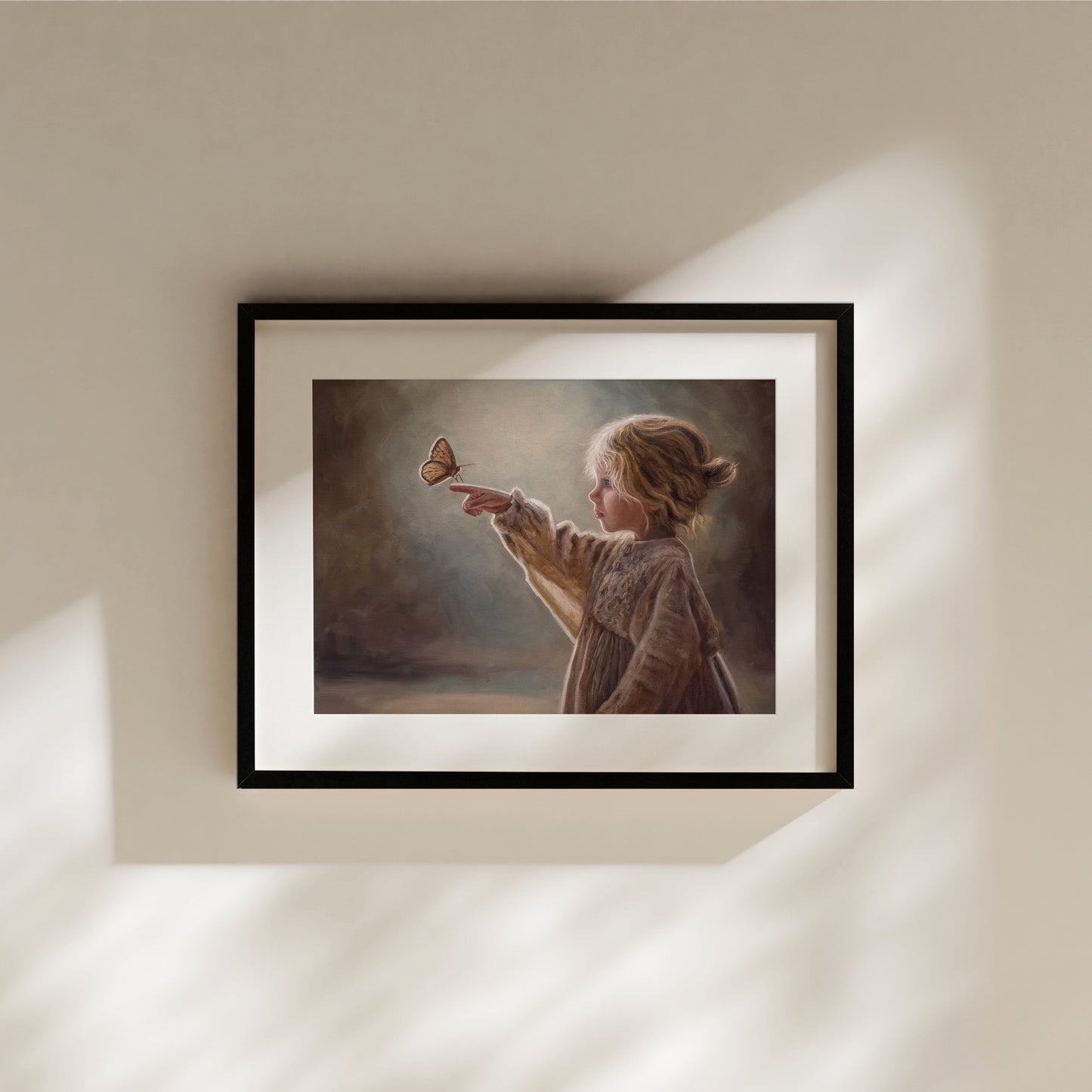 Girl with Butterfly Fine Art Print by Lauren Pretorius: a young girl reaching out to touch a butterfly against a soft, blurred background.