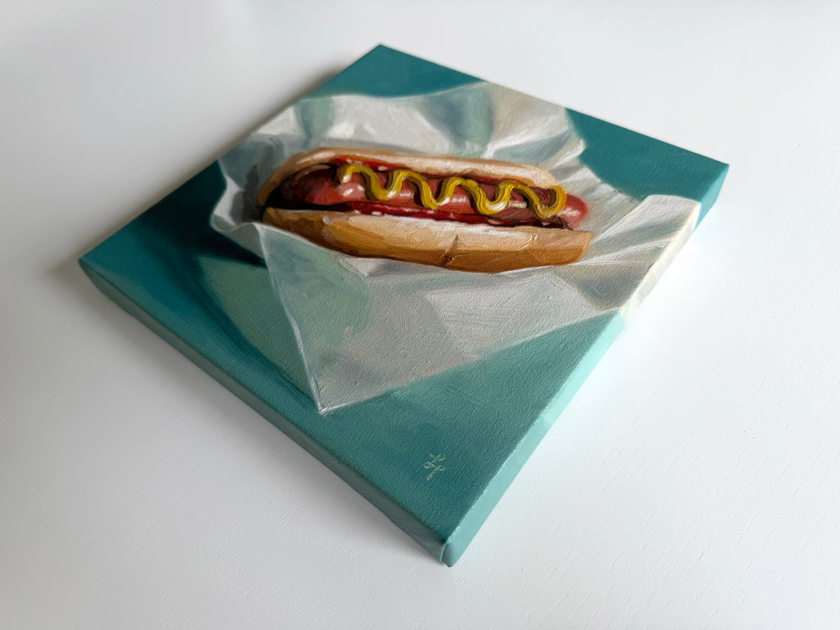 8x8 inch oil painting of a hot dog with mustard on crinkled deli paper against a teal background.