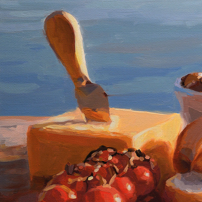 Original oil painting of a seaside picnic with butter, a spreader, and tomatoes against a soft blue background.