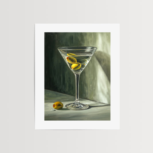 Martini & Olives Fine Art Print by Lauren Pretorius: a martini glass with olives, depicted with soft lighting and a shadow on the wall.