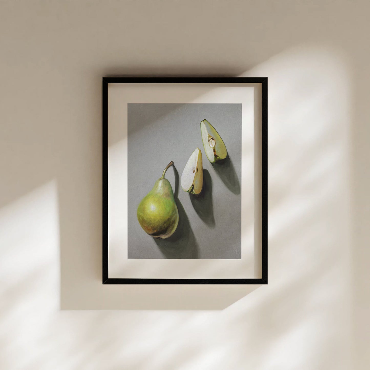 Framed fine art print of three green pears, one whole and two sliced, on a gray background.