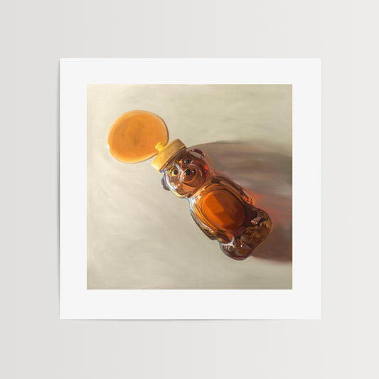 Spilled Honey Fine Art Print by Lauren Pretorius: a honey bear bottle that has tipped over and spilling its contents.