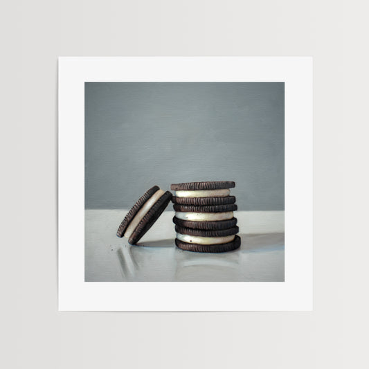 Stack of Cookies Fine Art Print by Lauren Pretorius: a trio of Oreos on a light, reflective surface with dramatic lighting and cast shadows.