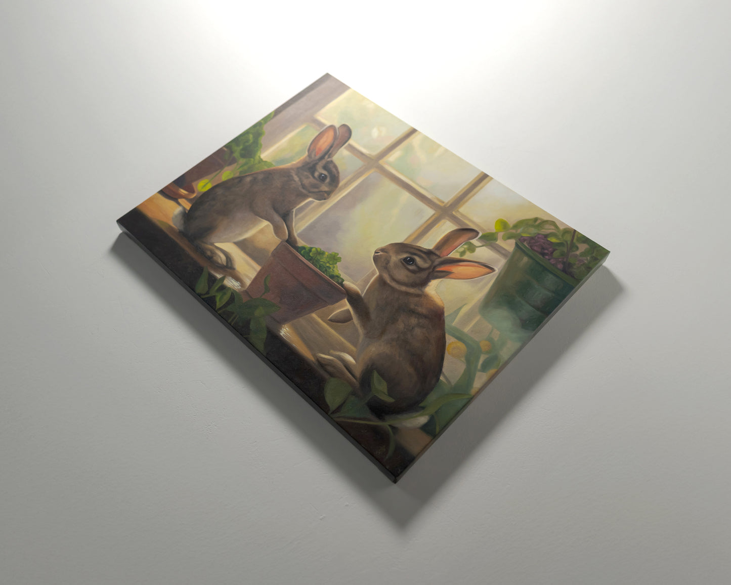 Sunroom Rabbits 20" x 16" Original Oil Painting by Lauren Pretorius: two rabbits interacting with a potted plant on a windowsill.