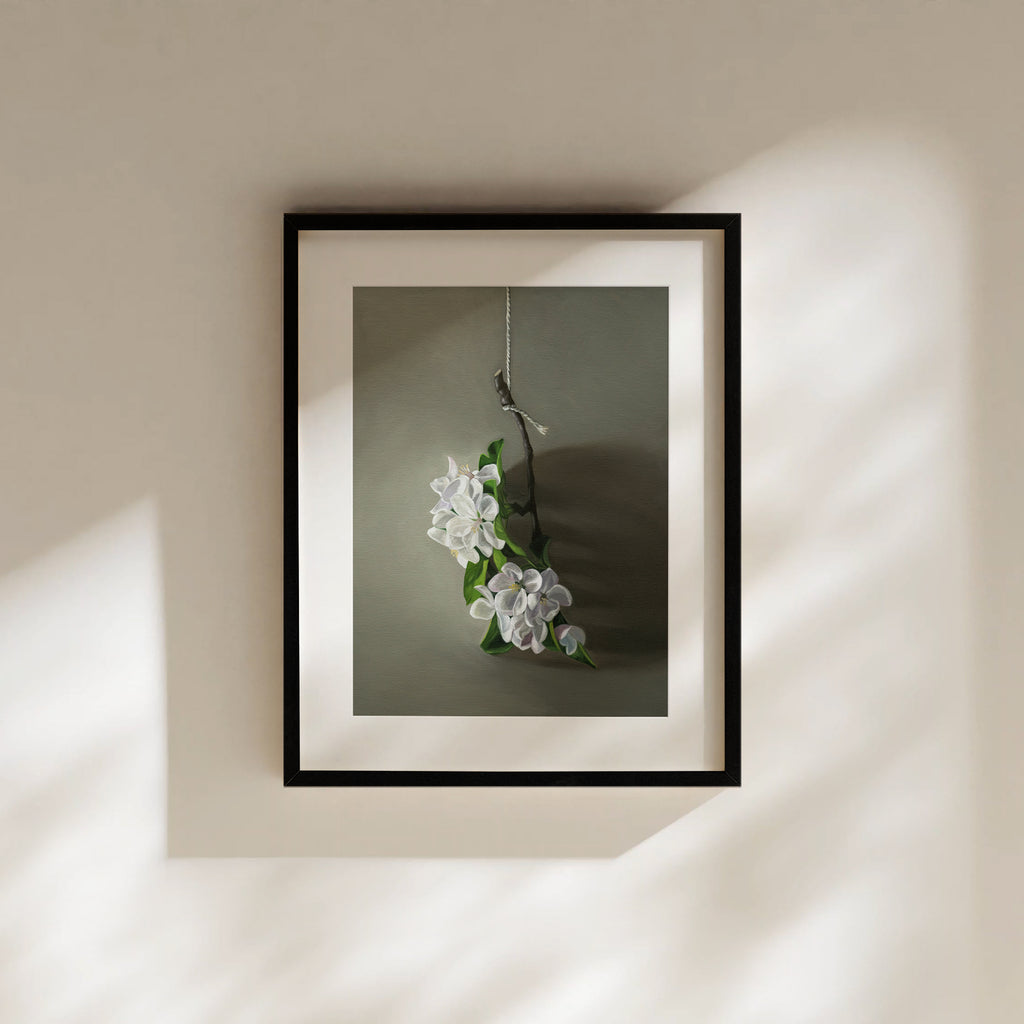 This artwork features a branch of apple blossoms dangling from a string with some nice dramatic lighting.