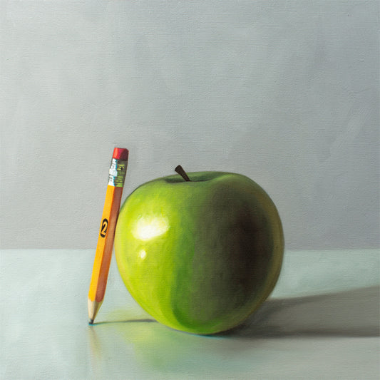 This artwork features granny smith apple and a well used #2 pencil on a light surface with dramatic lighting and cast shadows.