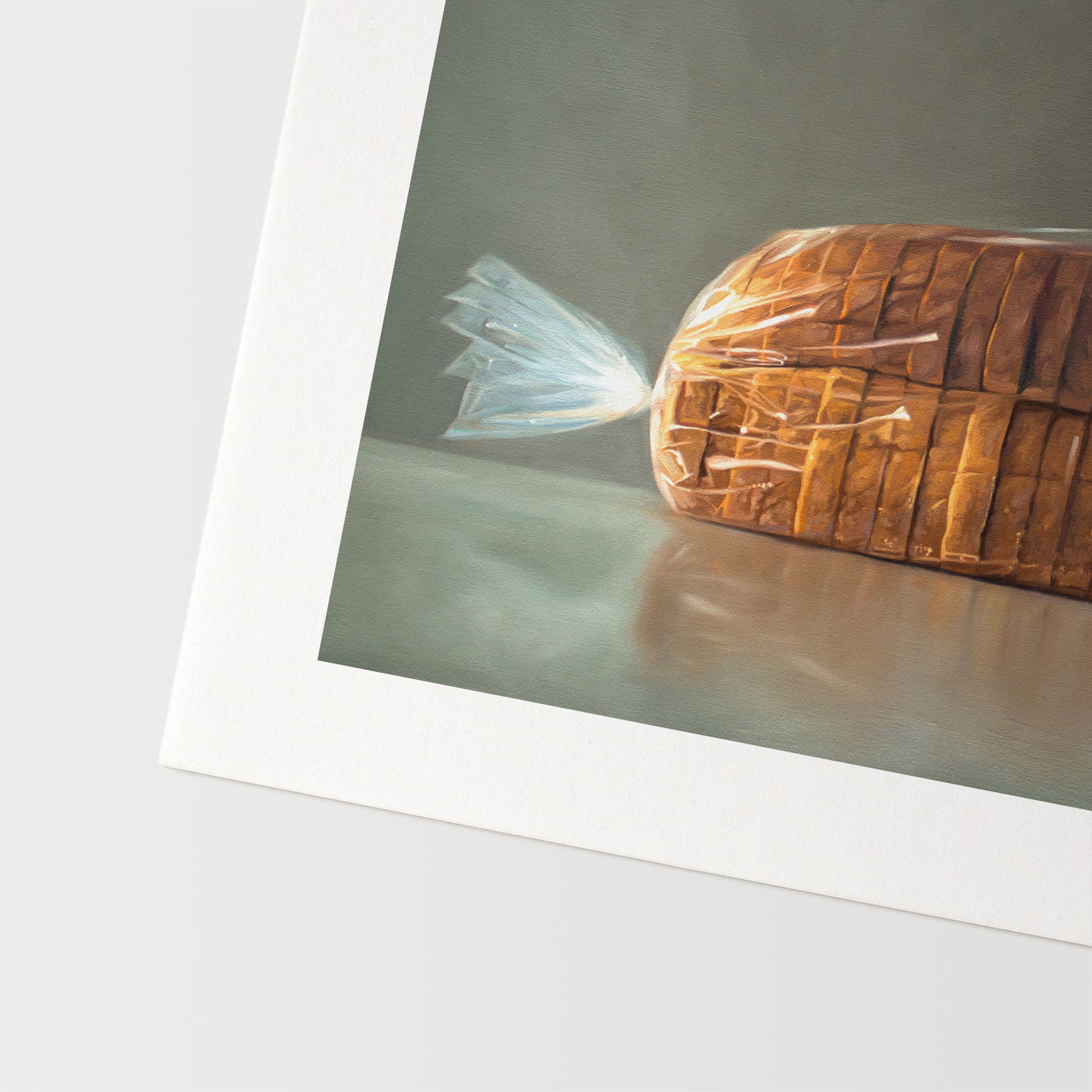 This artwork features a fresh loaf of bread in clear plastic wrap on a medium grey background.