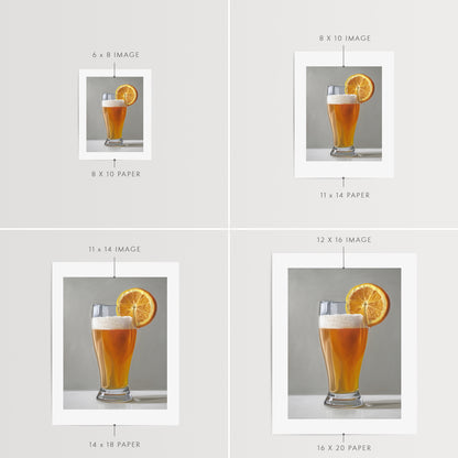 This artwork features a freshly poured Blue Moon beer in a glass with an orange slice and a nice bit of foam.