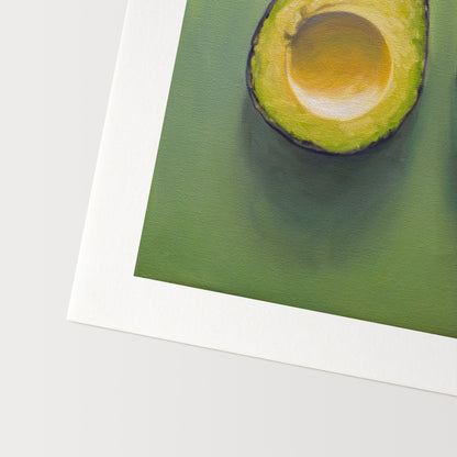 This artwork features a freshly sliced avocado resting on a matching green surface with some nice dramatic lighting.