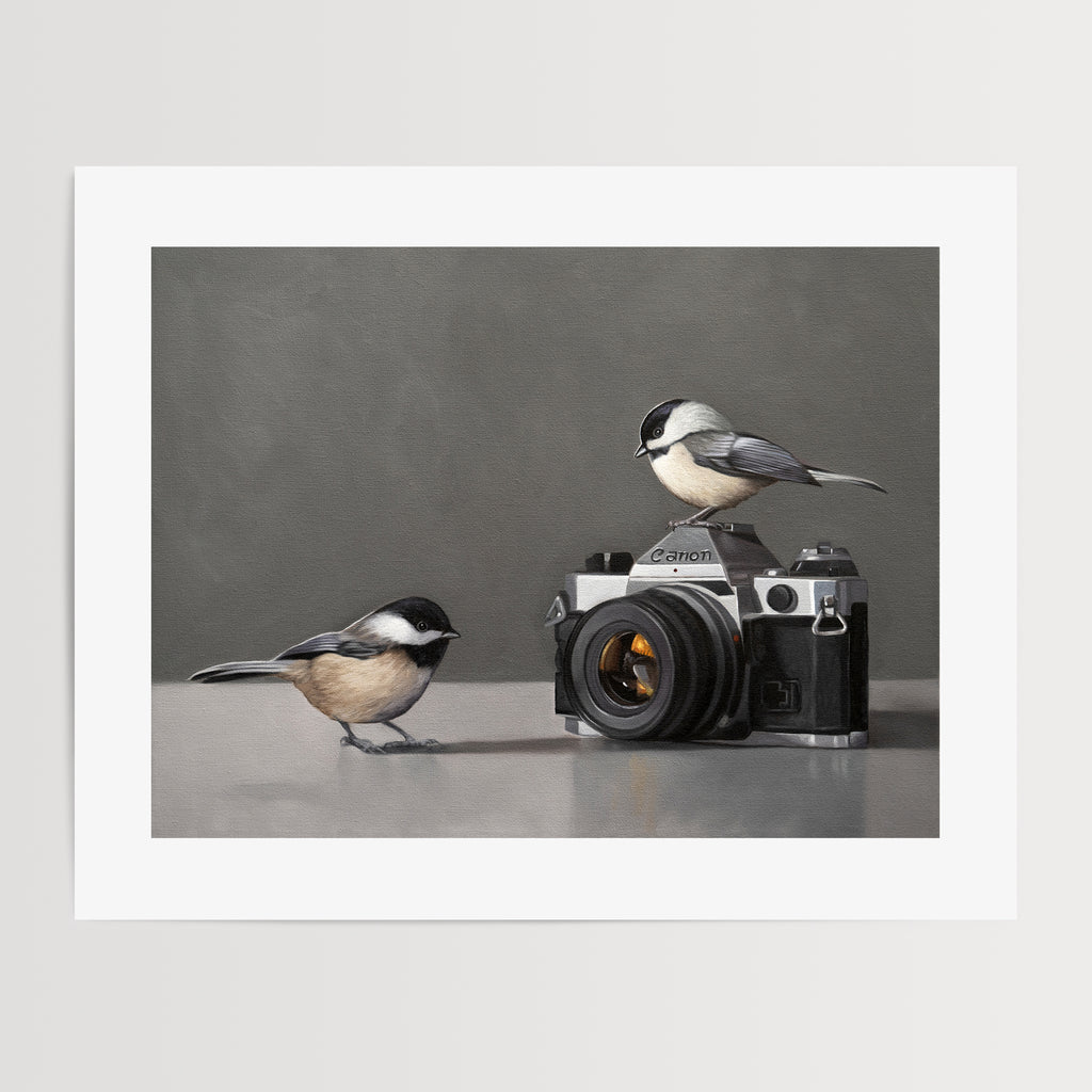 This artwork features a pair of inquisitive Chickadees investigating a vintage 35mm Canon Camera.