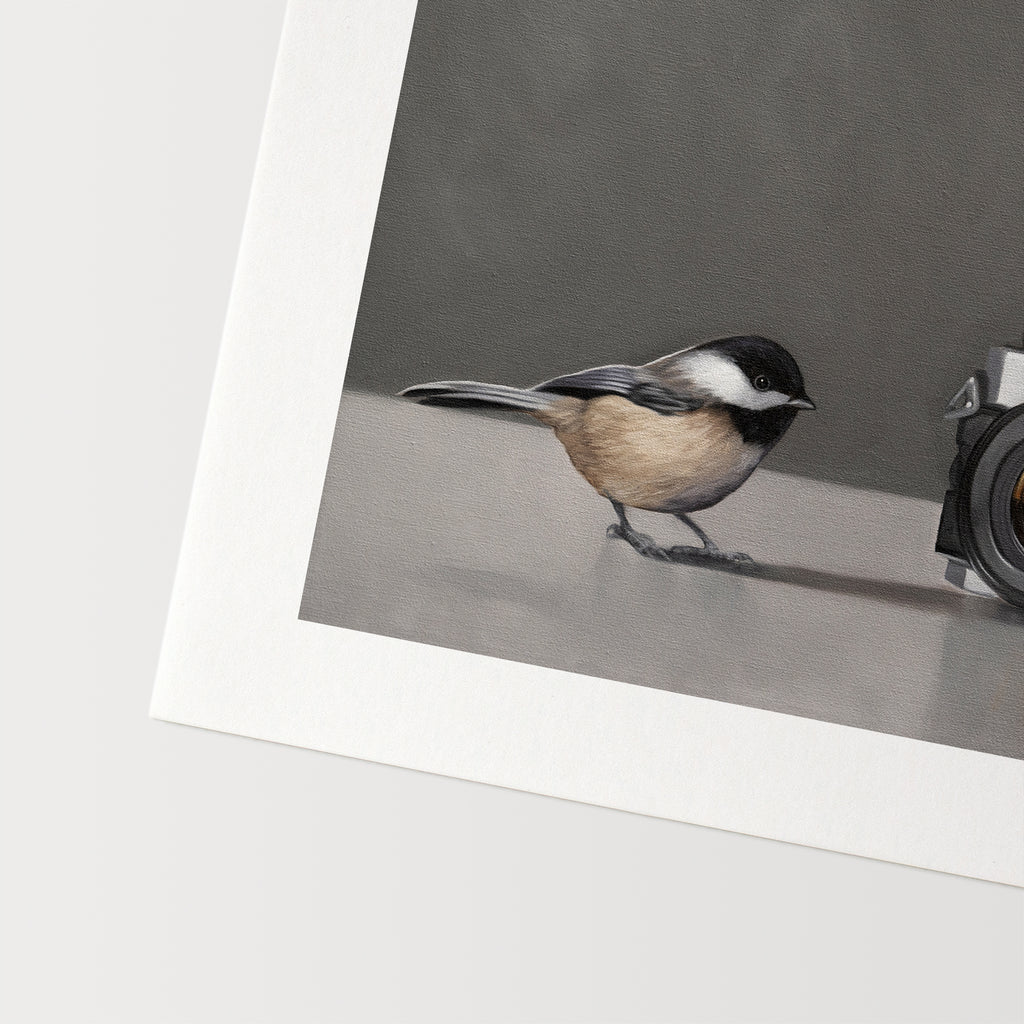 This artwork features a pair of inquisitive Chickadees investigating a vintage 35mm Canon Camera.