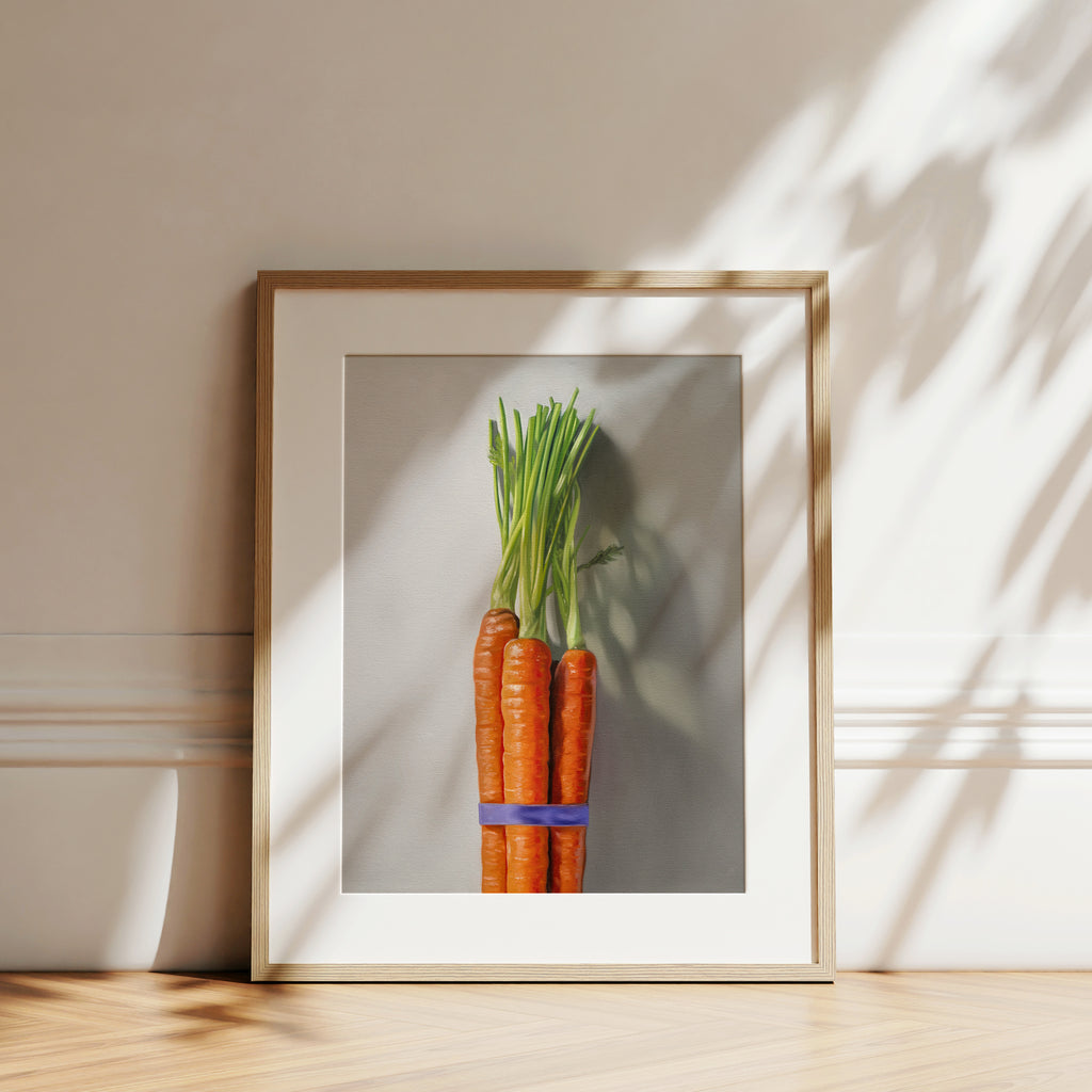 This artwork features a bundle of carrots resting on a neutral grey surface with dramatic side lighting creating interesting cast shadows.