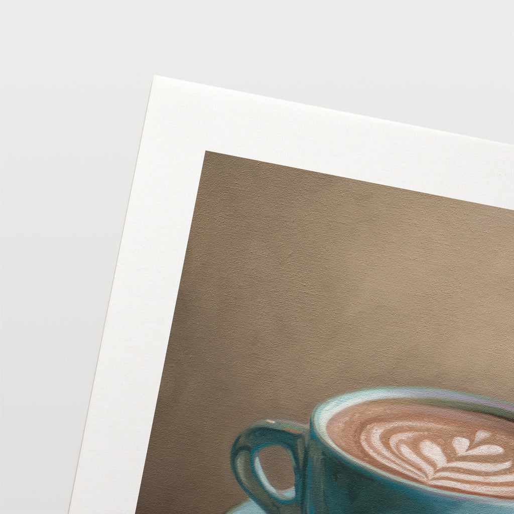 This artwork features a single blue coffee cup filled to the brim lan artful latte.