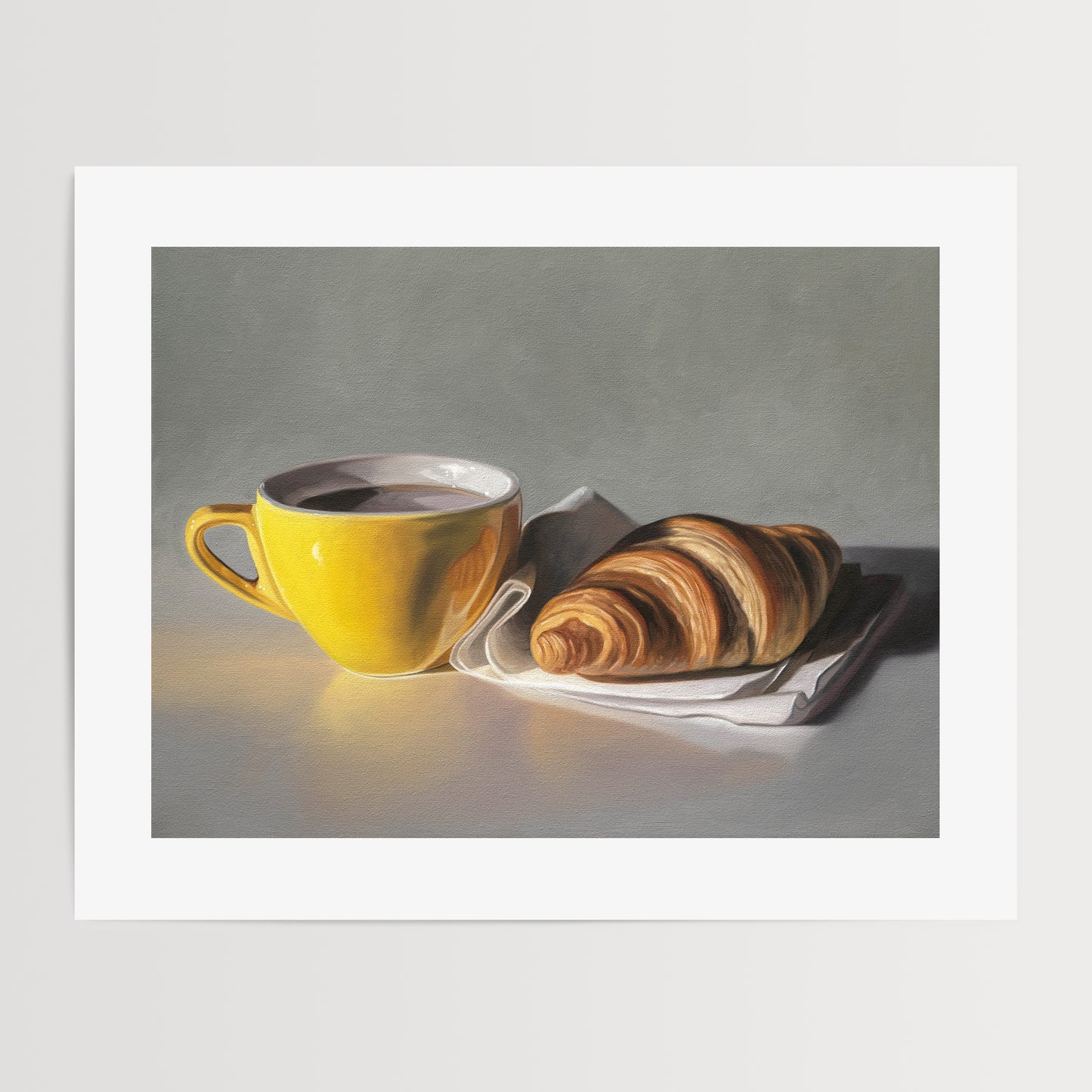 This artwork features a yellow cup of coffee and fresh croissant on a napkin.