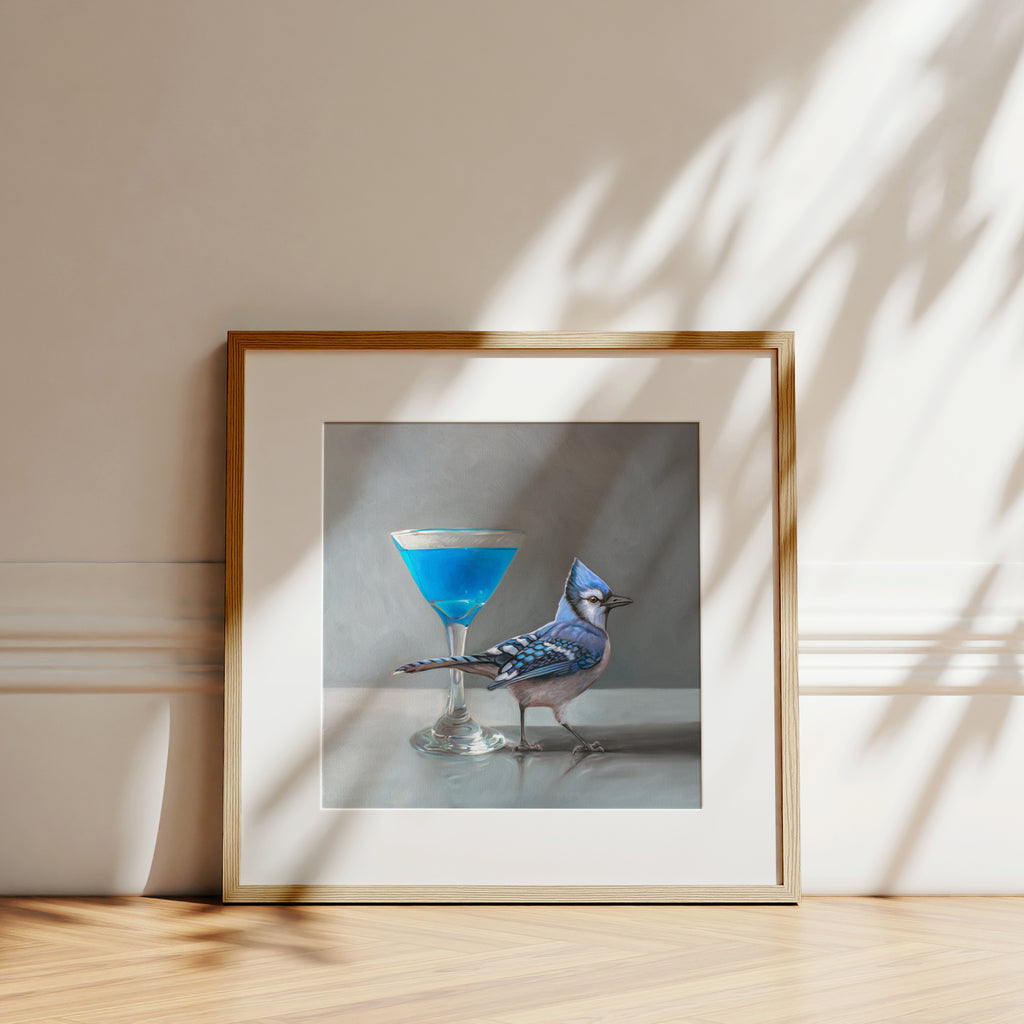 This artwork features a blue martini paired with a Blue Jay.This artwork is from a series of paintings that I am working on featuring birds and beverages.