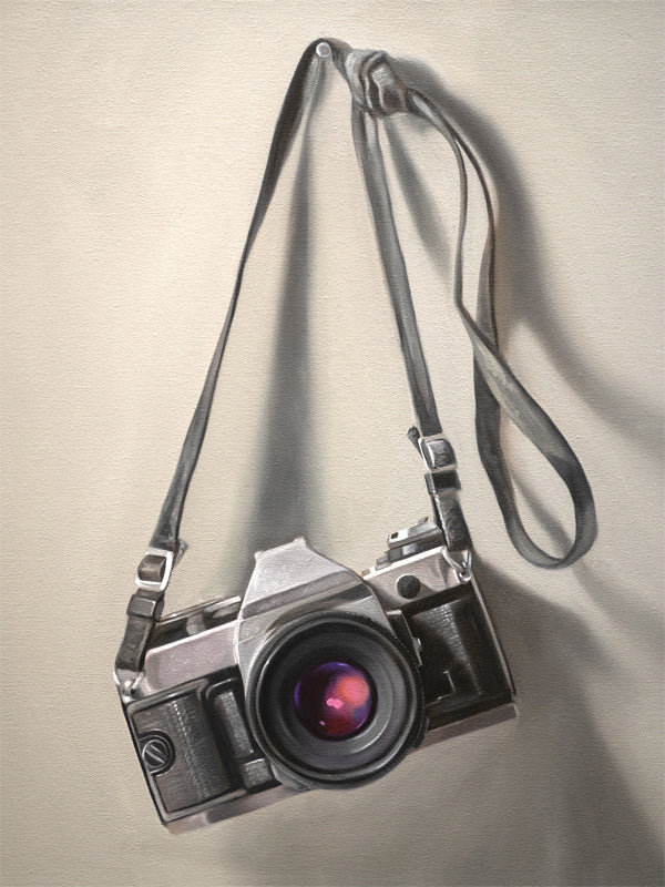 This artwork features a vintage 35mm camera hanging from its strap with some nice dramatic lighting.