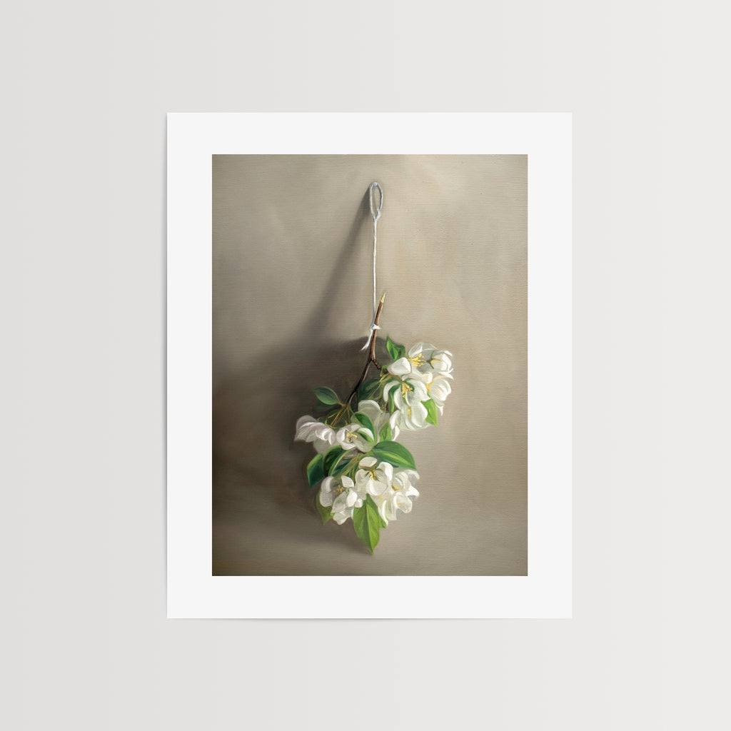 This artwork features a branch of crabapple blossoms hanging adjacent to a warm grey surface.