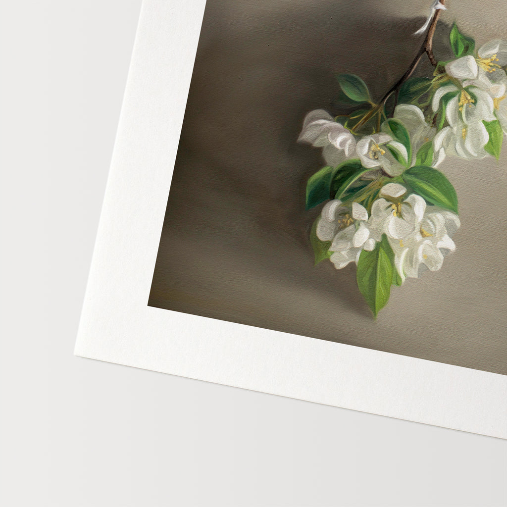 This artwork features a branch of crabapple blossoms hanging adjacent to a warm grey surface.