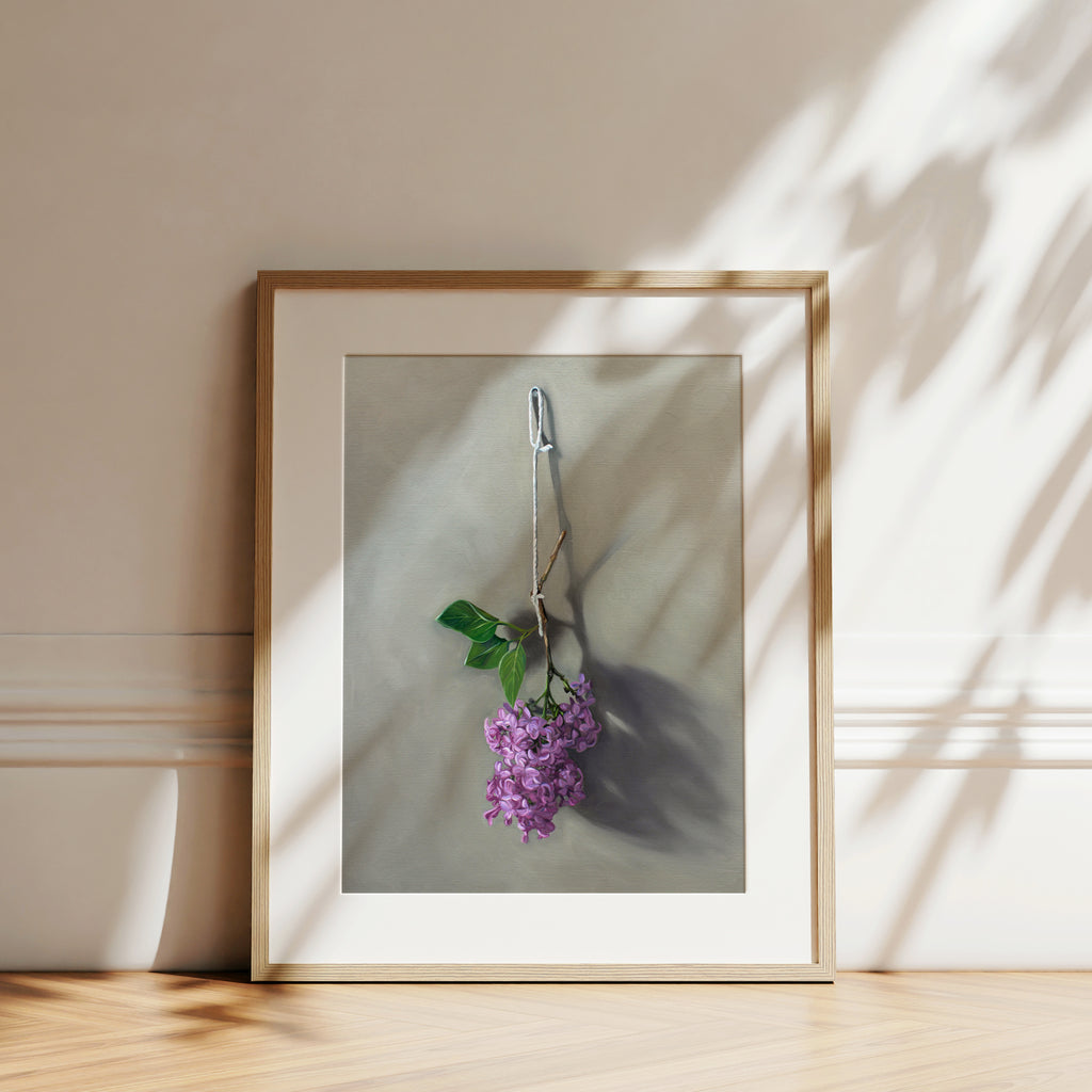 This artwork features Lilac blossoms hanging adjacent to a wall.