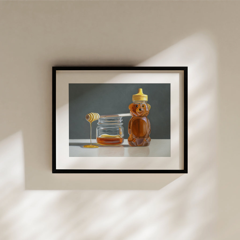 This artwork features a jar of honey with a drizzling honey dipper resting next to a honey bear on a reflective surface and neutral background.