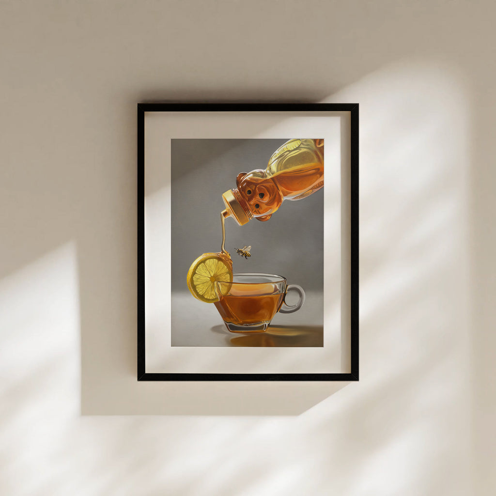 This artwork features a honey bee observing a backlit tipped honey bear bottle drizzling golden honey down onto a lemon slice that rests on the lip of a glass cup of tea.